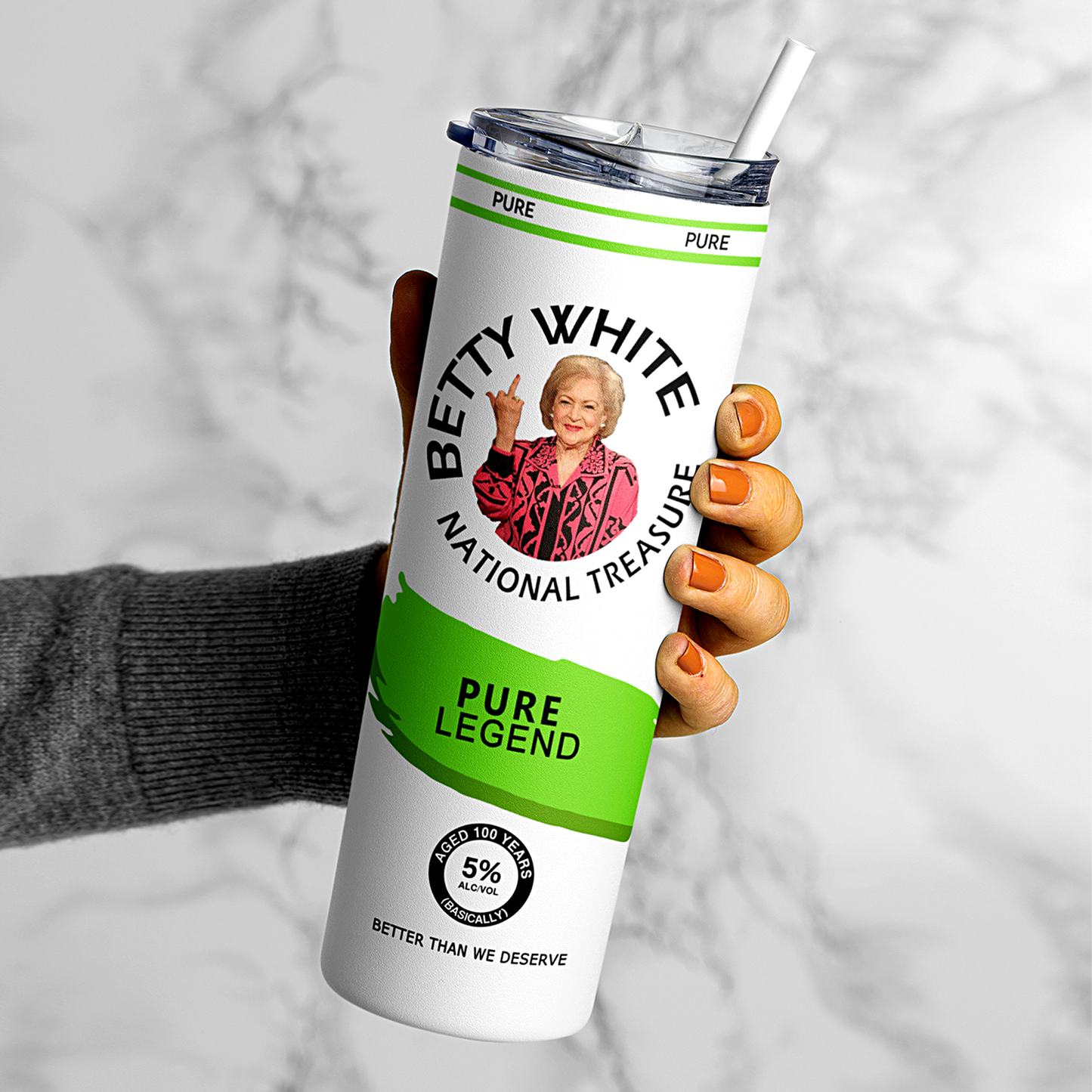 A 20oz stainless steel tumbler featuring an image of Betty White flipping the bird, designed in a hard seltzer theme. The tumbler includes a secure lid and straw, with a vibrant, long-lasting print. Perfect for fans of Betty White, sassy humor, and unique drinkware. Keeps beverages hot or cold for hours.