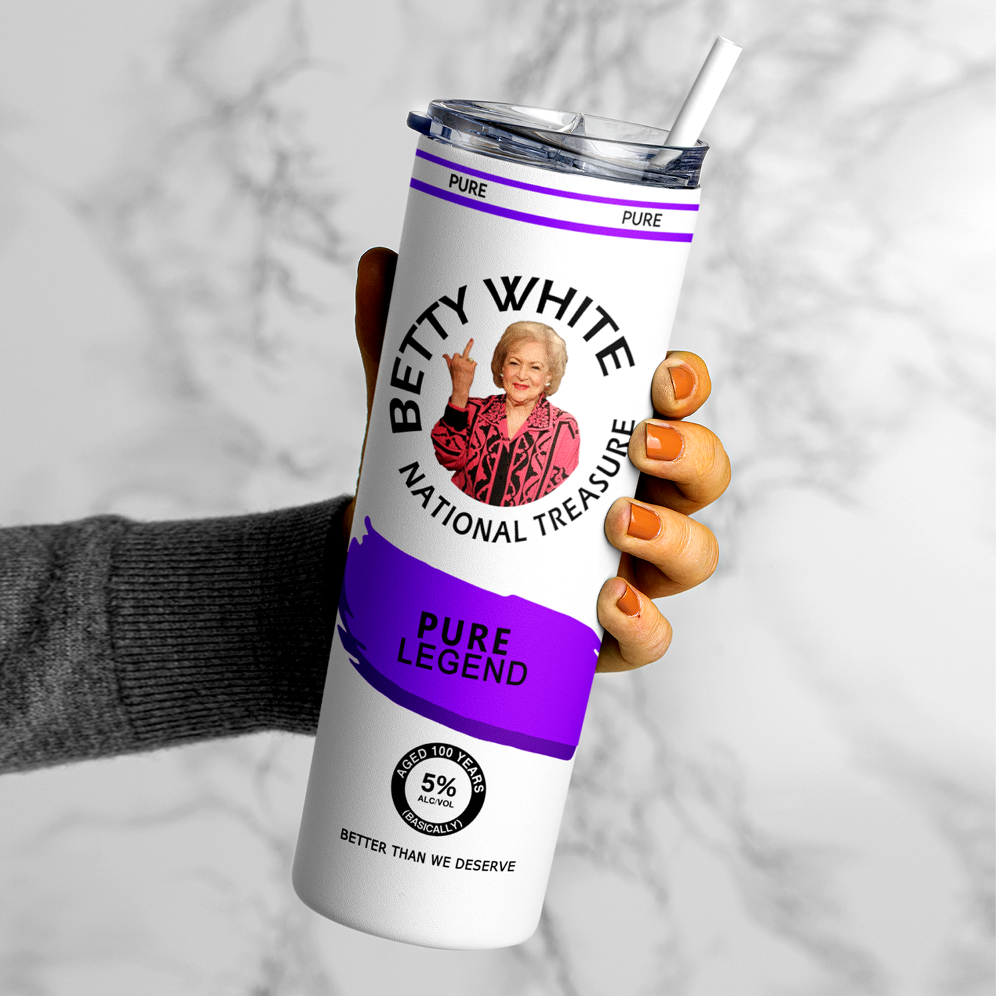 A 20oz stainless steel tumbler featuring an image of Betty White flipping the bird, designed in a hard seltzer theme. The tumbler includes a secure lid and straw, with a vibrant, long-lasting print. Perfect for fans of Betty White, sassy humor, and unique drinkware. Keeps beverages hot or cold for hours.