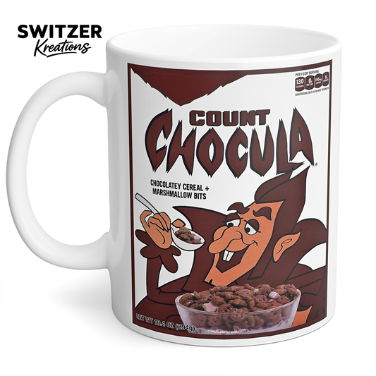 White ceramic coffee mug featuring a vintage Count Chocula-inspired cereal design, available in 11 oz and 15 oz sizes.