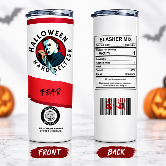 A white insulated tumbler shown from the front and back on a marble surface, with Halloween-themed graphics. The front features a red and black design with a Michael Myers illustration and the words 'HALLOWEEN HARD SELTZER' and 'FEAR.