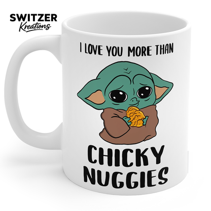 I Love You More Than Chicky Nuggies 11oz white ceramic coffee mug with cute green character holding chicken nuggets